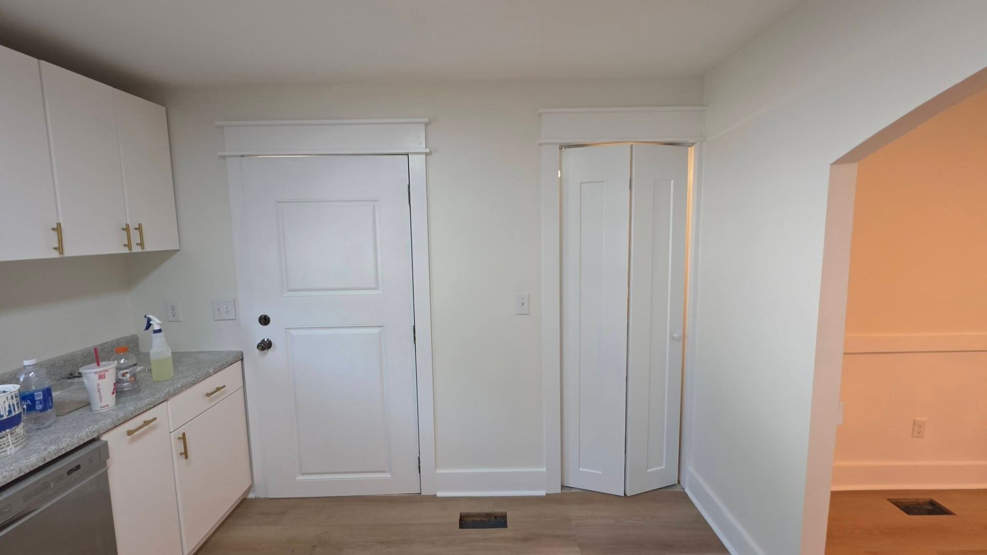 Interior doors and trim after — fresh white finish with crisp casings